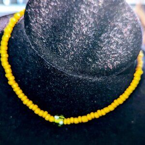 New choker style yellow glass beads with a green center accent glass bead